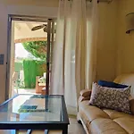 Coqueto Adosado Planta Baja Con Pequeno Jardin Privado Y Salida A Piscina
